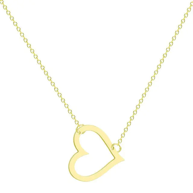 A delicate gold chain necklace featuring a tilted, hollow heart-shaped pendant. The heart is asymmetrically attached at both top curves to the chain, giving it a stylish slant. The background is plain white, highlighting the necklace's elegant and minimalist design.