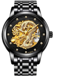 Black metal wristwatch with a link bracelet and a textured black dial featuring a gold dragon skeleton design and crystal hour markers, shown on a dark background.