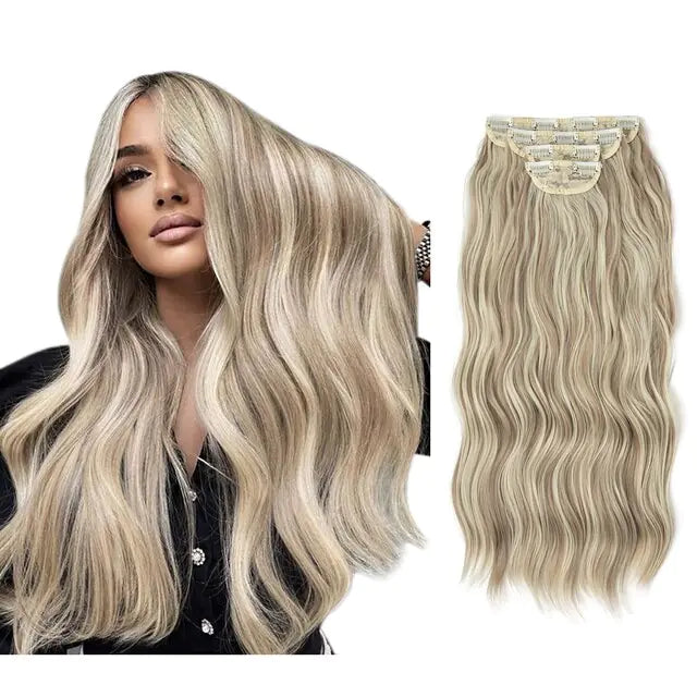 Side-by-side image showing a woman with long, wavy platinum blonde hair and a matching wavy clip-in hair extension set displayed from the back on a white background.