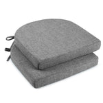 Two gray cushioned seat pads on a white background