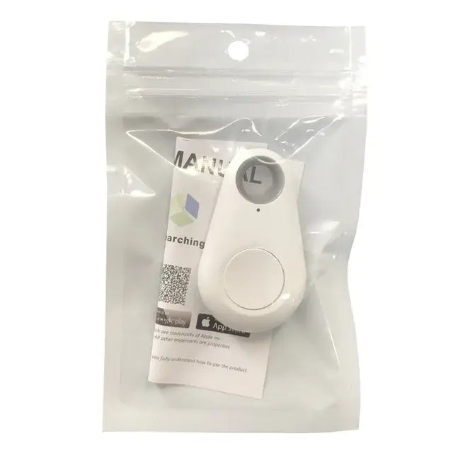 A small white key-finder tracker with a round button and LED sits inside a clear resealable pouch, with a folded instruction card behind it.