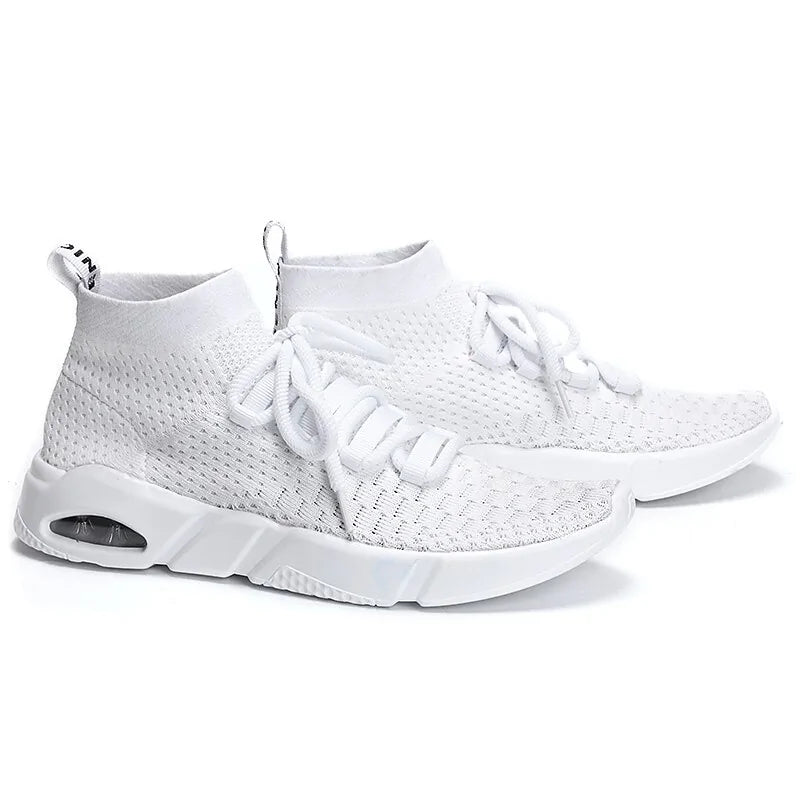 A pair of white knit high-top sneakers with a sock-like ankle collar, lace-up front, and chunky white soles. The shoes feature a breathable textured upper and a visible air-cushion detail near the heel.