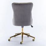 Gray office chair with gold base on a white background
