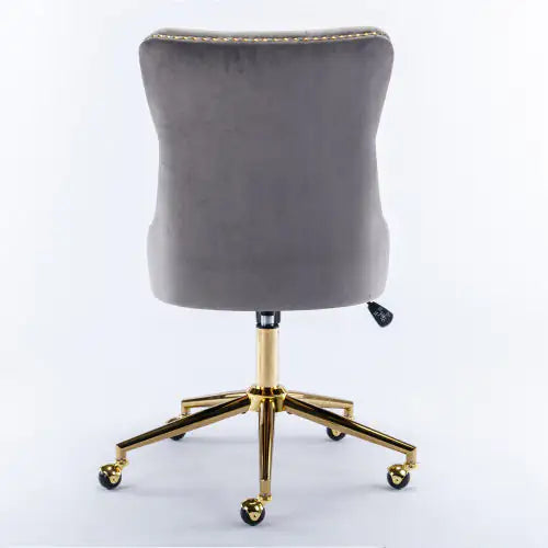 Gray office chair with gold base on a white background