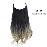 Long wavy halo hair extension with dark brown roots fading to light blonde ends, on a white background.