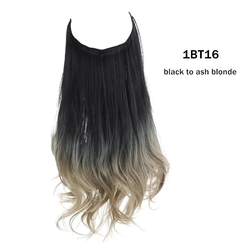 Long wavy halo hair extension with dark brown roots fading to light blonde ends, on a white background.