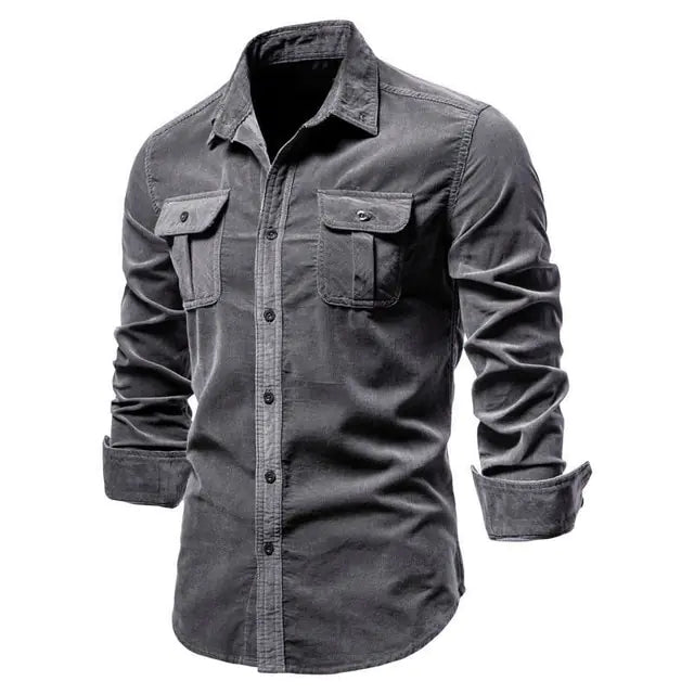 A stylish long-sleeved button-up shirt with a classic collar. The shirt features two symmetrical chest pockets with buttoned flaps, giving it a rugged yet sophisticated look. The sleeves are slightly rolled up, adding a casual touch to the overall design.
