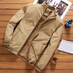 Tan zip-up jacket with warm fleece lining and stand collar.
