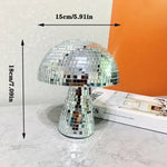 A silver mushroom-shaped lamp covered in small mirrored tiles, with dimensions (15 cm / 5.91 in width and 18 cm / 7.09 in height) indicated next to the lamp.