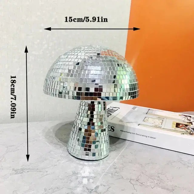 A silver mushroom-shaped lamp covered in small mirrored tiles, with dimensions (15 cm / 5.91 in width and 18 cm / 7.09 in height) indicated next to the lamp.