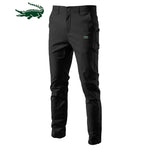 A pair of slim-fit pants with a button closure, belt loops, and side pockets. The fabric appears to be lightweight, suitable for casual or semi-formal wear.