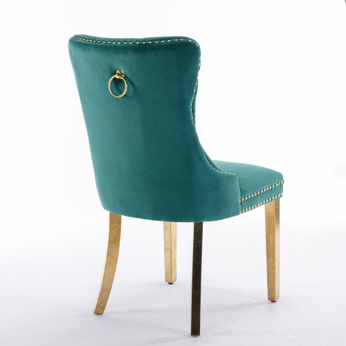 Teal velvet chair with gold accents on a white background