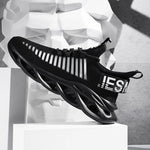 Black knitted trainers with white stripe detail.