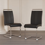 Two black chairs with chrome frames on a wooden floor.