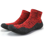 Red and black water shoes with a sock-like upper.