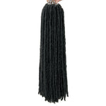 A studio product image of long black faux locs/dreadlock hair extensions being held up by a hand, with multiple bundles gathered at the top and thick rope-like twists hanging straight down against a white background.