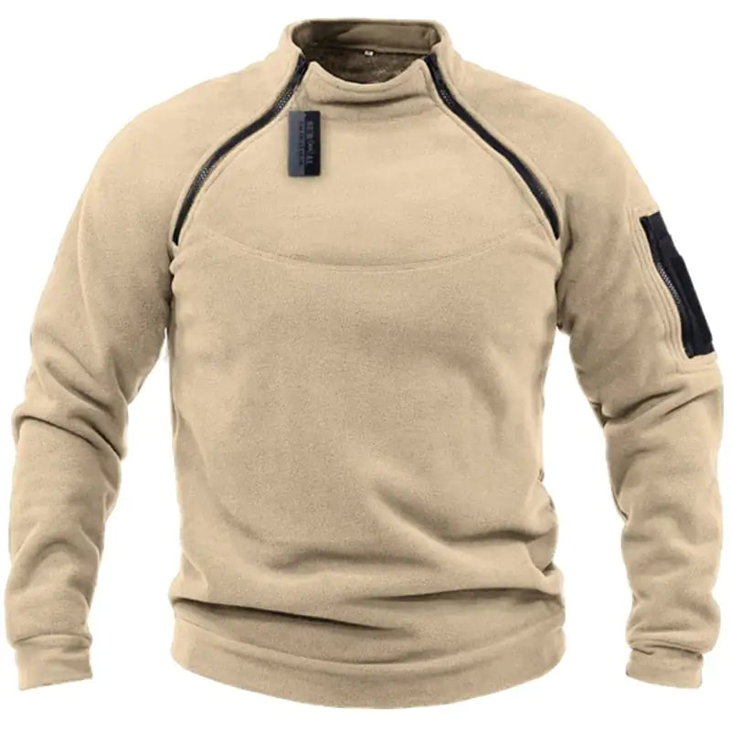 A dark gray long-sleeve fleece pullover with zipper detailing on the shoulders and a zippered pocket on the left sleeve.