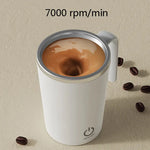Self-stirring white coffee mug with a vortex swirling inside, shown with coffee beans and text reading “7000 rpm/min.