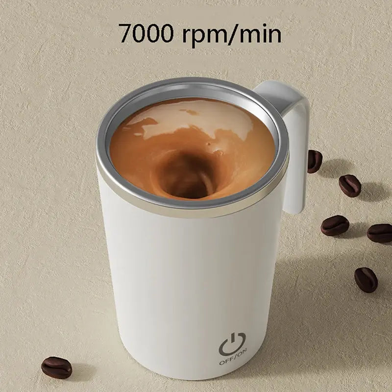 Self-stirring white coffee mug with a vortex swirling inside, shown with coffee beans and text reading “7000 rpm/min.
