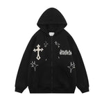 Black zip-up hoodie with a white cross graphic, star-like motifs, and gothic-style chest print.