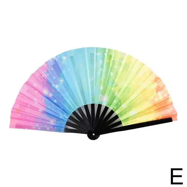 A colorful folding fan with a gradient pattern transitioning from pink to blue to green, with a sparkling effect, and black spokes and handle.