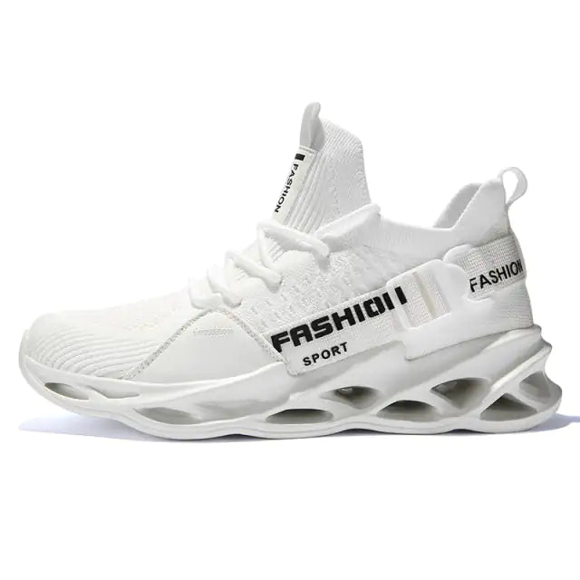 A chunky gray and black sneaker with orange laces and accents, a thick white-and-black rugged sole, shown on a white background.