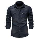 Dark navy/black long-sleeve button-up shirt with a spread collar, brown buttons, and two flap chest pockets, shown on a white background with the cuffs slightly folded.