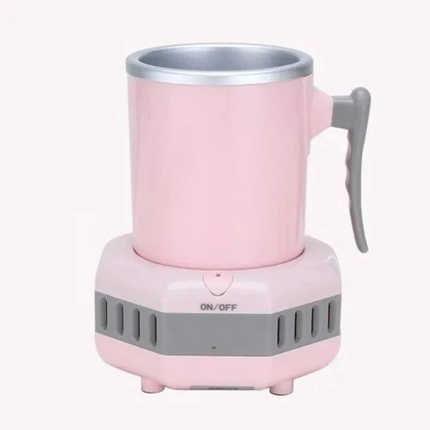 Pink electric heating mug with a metal-lined cup and gray handle, sitting on a matching pink-and-gray base with ventilation slots and an “ON/OFF” button.