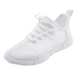 White lace-up trainer with floral textured fabric, chunky segmented sole and rear pull tab.
