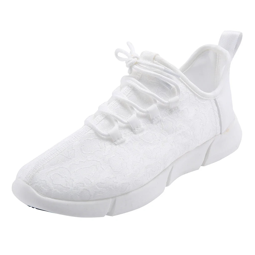 White lace-up trainer with floral textured fabric, chunky segmented sole and rear pull tab.
