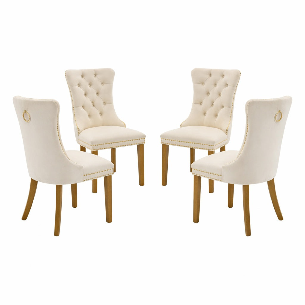 Set of four cream-colored dining chairs with wooden legs on a white background