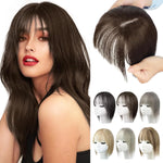 Product collage showing a woman wearing a long, wavy dark-brown wig with wispy bangs, a close-up of the wig’s top and part held in hands, and six small color options displayed on mannequin heads.