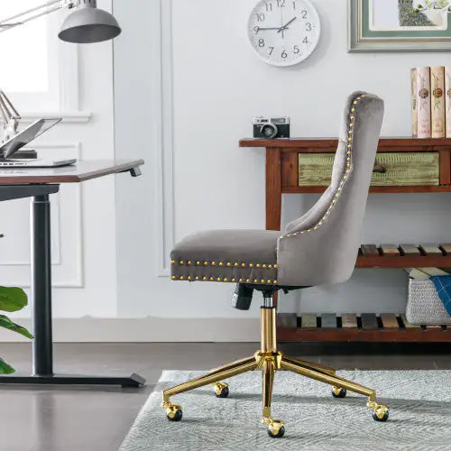 Gray office chair with gold accents in a home office setting