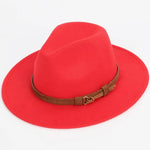 Bright red wide-brim fedora hat with a brown buckle band.