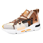 Beige and brown chunky high-top trainers with orange accents.
