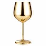 Gold wine glass on a white background