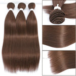 Three bundles of long, straight brown hair extensions laid side by side on a white background, each tied at the top with a small band.