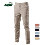 A pair of slim-fit pants with a button closure, belt loops, and side pockets. The fabric appears to be lightweight, suitable for casual or semi-formal wear.