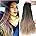 Side-by-side product image showing a woman wearing a long, wavy black wig (left) and the same wig displayed from the back on a mannequin against a white background (right).