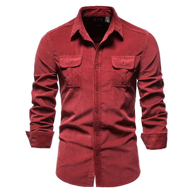 A stylish long-sleeved button-up shirt with a classic collar. The shirt features two symmetrical chest pockets with buttoned flaps, giving it a rugged yet sophisticated look. The sleeves are slightly rolled up, adding a casual touch to the overall design.