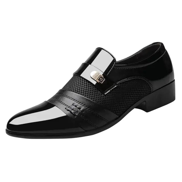 A black formal dress shoe with a glossy toe, brown strap detail, mesh side panels, and a low heel.