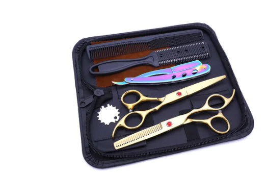 Haircutting kit in a black zippered case, containing two gold scissors, a thinning shear, a rainbow folding razor, combs, and a small cleaning brush.