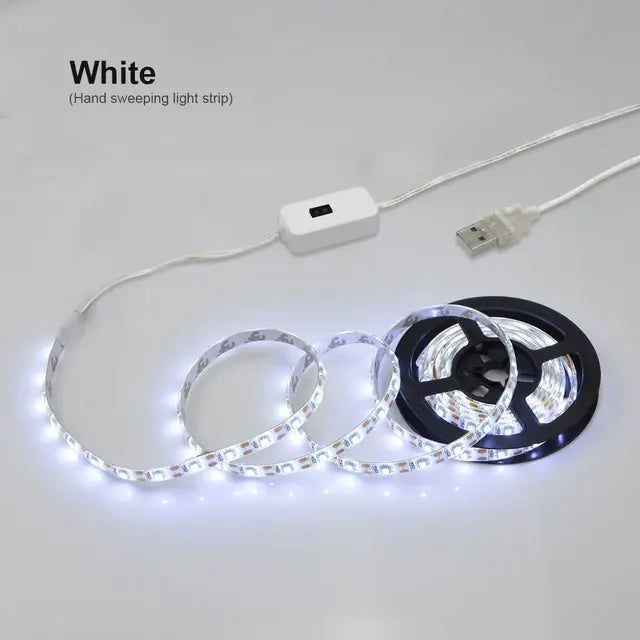 White USB LED strip light with inline switch, partially unrolled and illuminated.