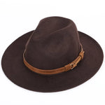 Brown felt fedora-style hat with a wide brim and a tan leather band featuring a small buckle, photographed on a white background.