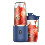 Blue portable blender with a clear cup filled with splashing strawberry drink, shown next to a matching sports-lid cup; caption reads “Double cup body + 1 sports cup cover” with feature text including dual motors, 6-blade blade, 304 stainless steel, and lithium battery.