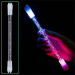 LED bubble light wand with clear tube and glowing blue-to-pink lights, shown lit in a hand against a black background, with an unlit version pictured on the left.