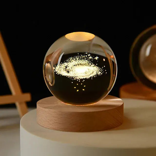 Illuminated crystal ball with 3D artwork