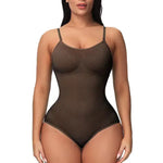 Woman modeling a brown seamless shapewear bodysuit with spaghetti straps and brief-cut bottom, shown on a white background.