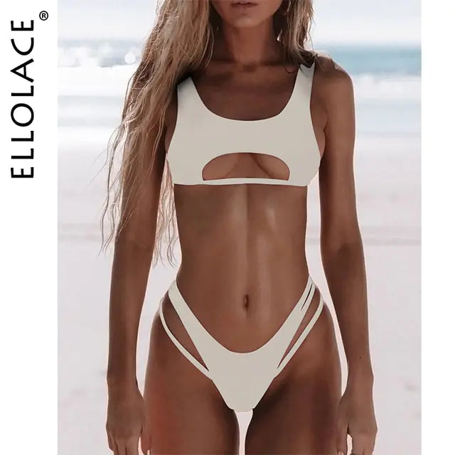 Model wearing a lilac/off-white cutout bikini set on a beach, with “ELLOLACE” text along the left side.