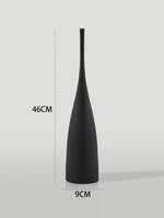 Tall matte black bottle-shaped vase, 46 cm high and 9 cm wide at the base.